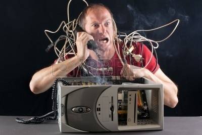 6836436-man-having-his-computer-burning-phoning-technical-support-for-help-jpg.jpg