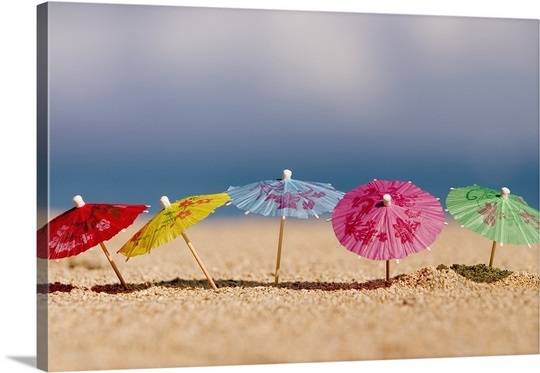 close-up-of-cocktail-umbrellas-in-the-sand,1405297.jpg