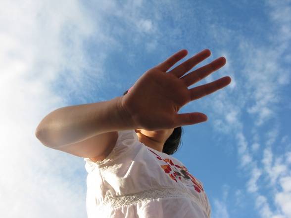 Hand-Blocking-Girls-Face-and-Blue-Sky-Medium.jpg