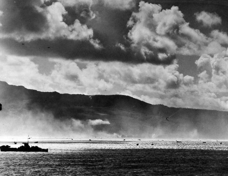 Japanese_Plane_Falls_into_Sea_as_US_Landing_Craft_Storm_Saipan.jpg