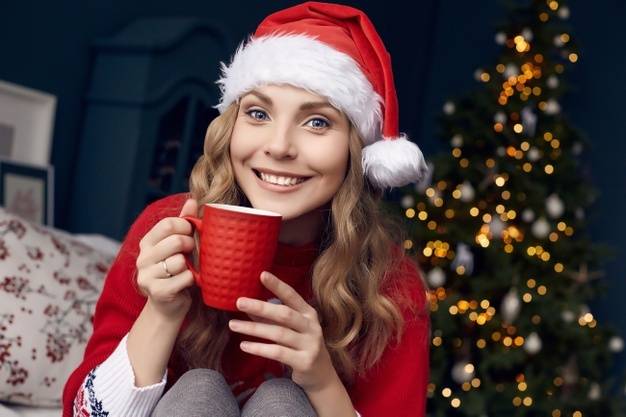 onde-woman-red-sweater-santa-hat-with-cup-coffee-posing-christmas-decorated-interior_149155-4928.jpg
