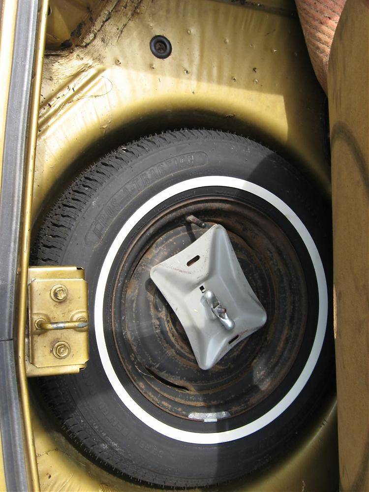 original spare tire in trunk well.jpg