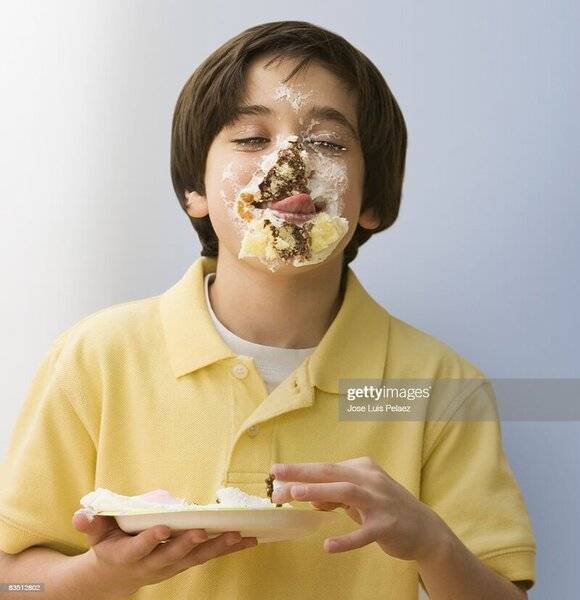 oung-boy-with-face-full-of-cake-picture-id83512802.jpg