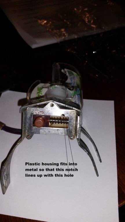 Plastic housing in metal bracket.jpg