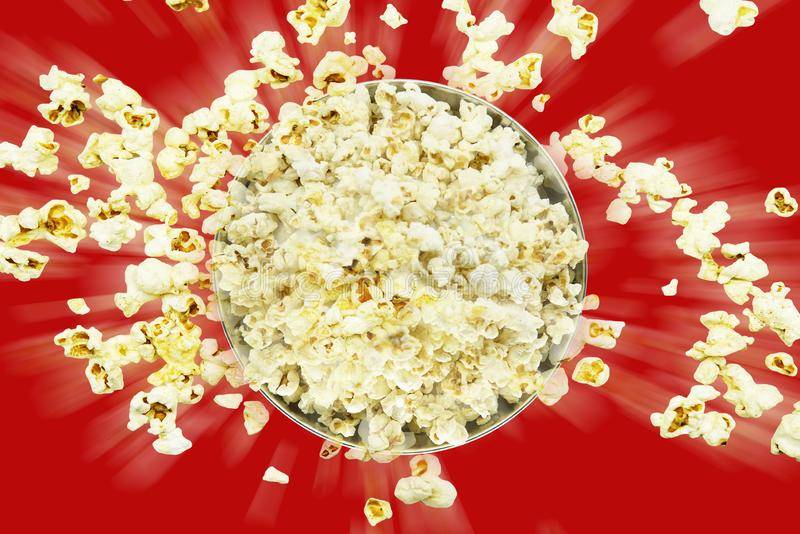 top-view-popcorn-explosion-red-background-cinema-entertainment-concept-125837884.jpg